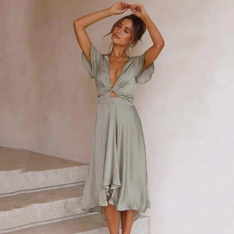 Laura - Belle robe avec épaules et ourlet inhabituels